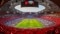 The photo shows the filled Allianz Arena during a football match.